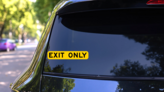 Yellow Exit Only Sticker on a Rear Car Window (New) example