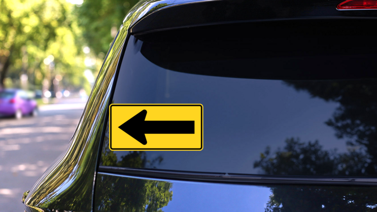 Yellow Left Arrow Sticker on a Rear Car Window (New) example