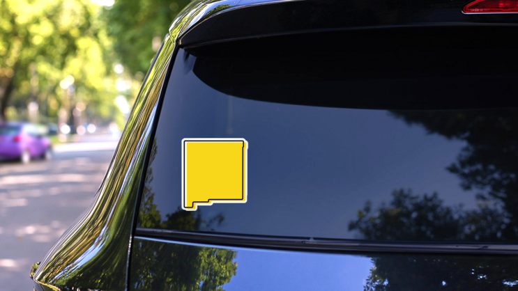 Yellow Outline Map Of New Mexico Sticker on a Rear Car Window (New) example