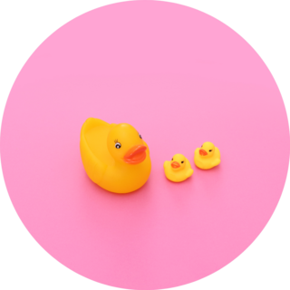 Yellow Rubber Duck With Little Baby Ducks On Pink Background Sticker