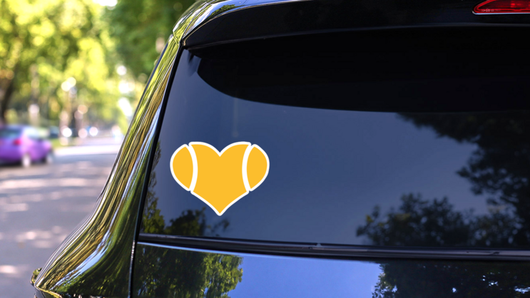 Yellow Tennis Ball Heart Sticker on a Rear Car Window (New) example