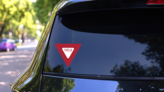 Yield Sign Sticker on a Rear Car Window (New) example