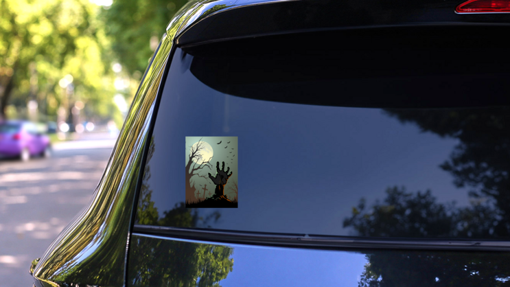 Zombie Hand Reaching Up From Grave Sticker on a Rear Car Window (New) example