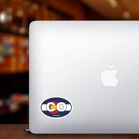 Colorado Co State Flag Oval Sticker on a Laptop example