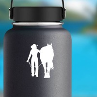 Gentle Cowgirl Walking Her Horse Sticker on a Water Bottle example